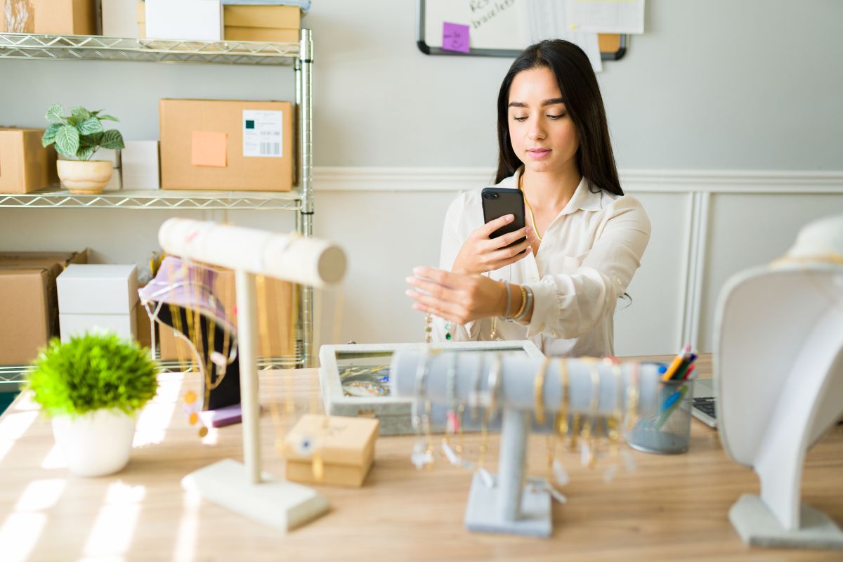 A girl photographing jewellery to sell